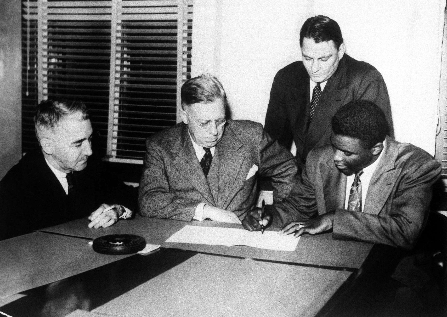Jackie Robinson signs with Montreal